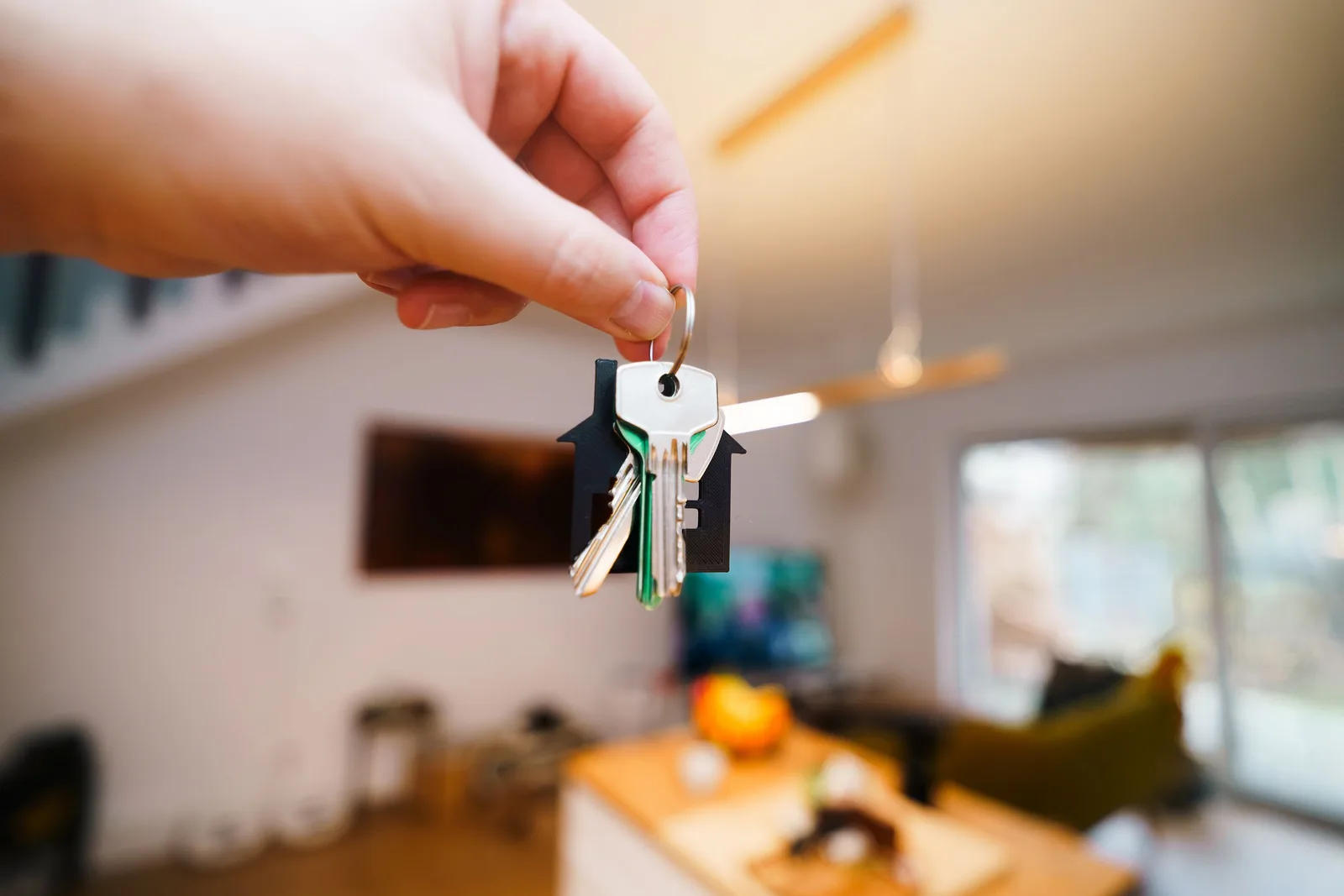 Property manager reviewing a condo key access log at a building front desk