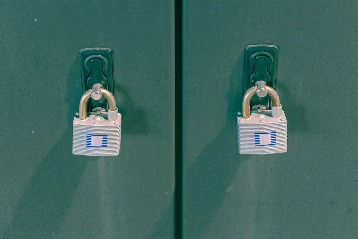 Property manager reviewing a lockbox realty access log at a building front desk